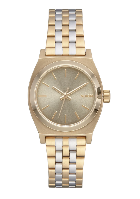 A Nixon analog watch with a two-tone gold and silver metal bracelet, a gold-tone case, and a textured champagne-gold dial.