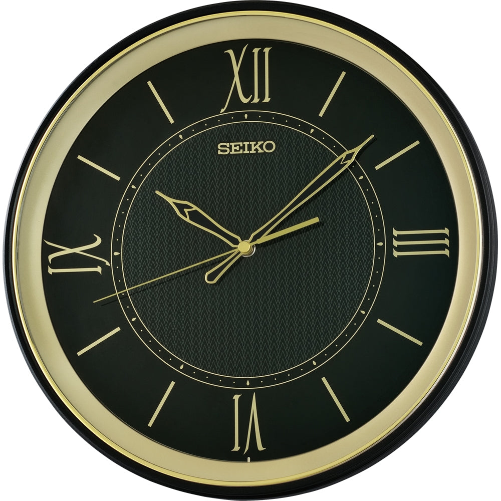 A round Seiko wall clock with a black face, gold Roman numerals and hands, and a gold outer bezel